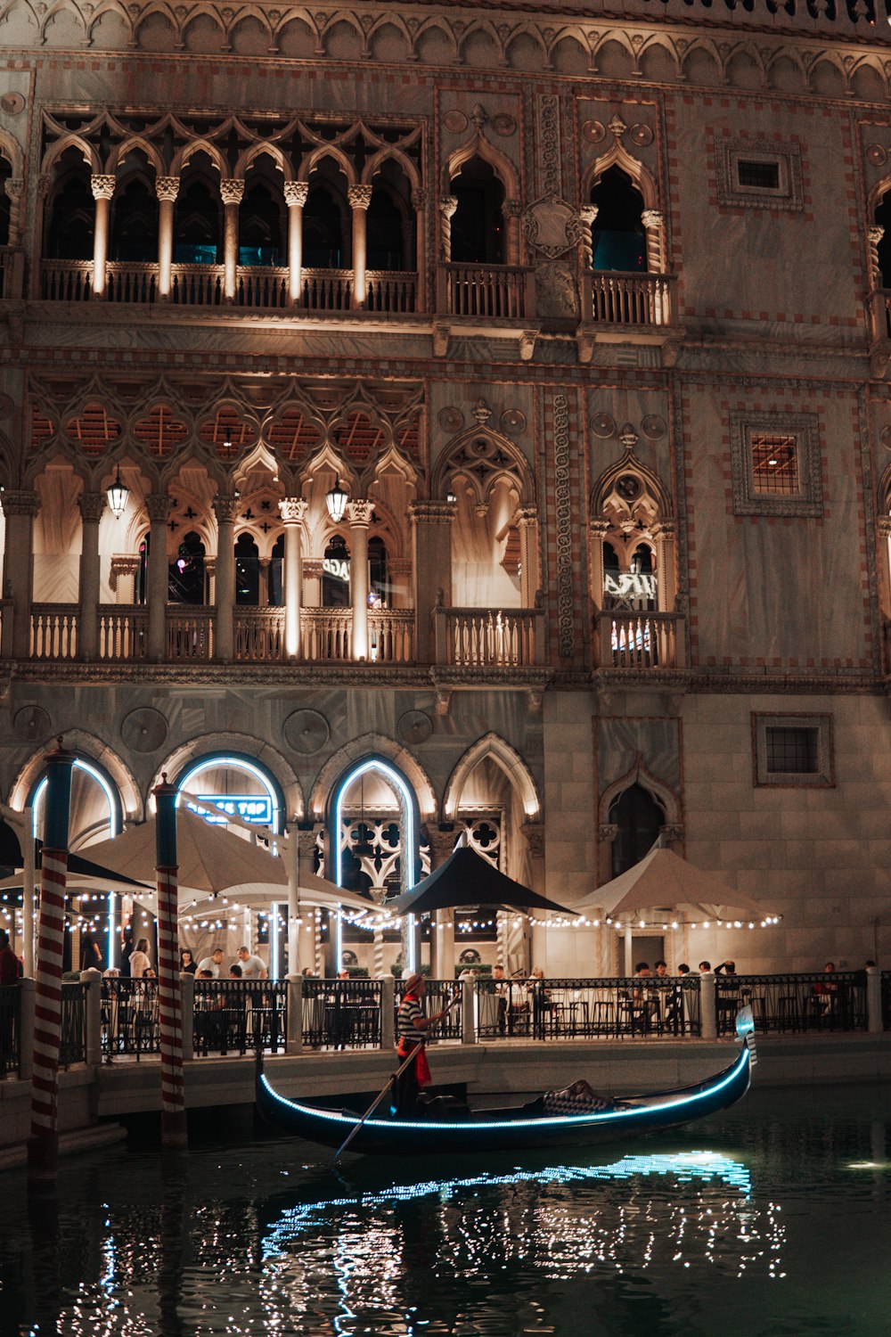 a gondola in the middle of a canal at night