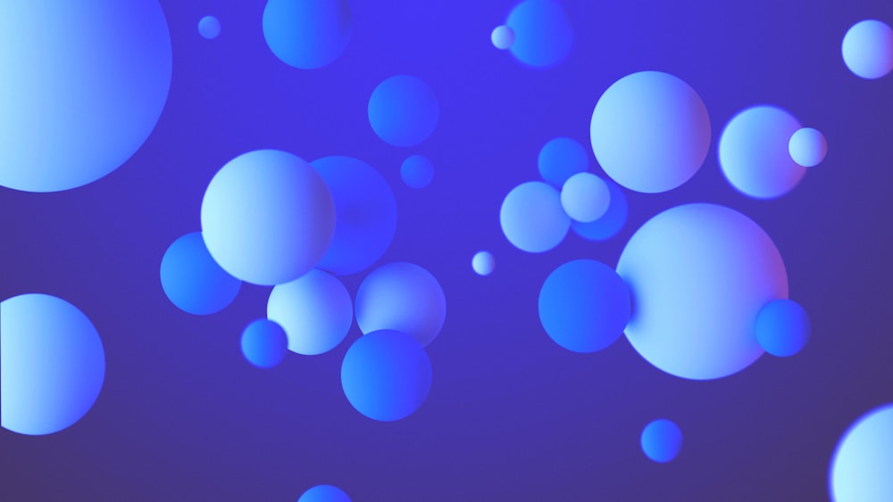 a bunch of blue bubbles floating in the air