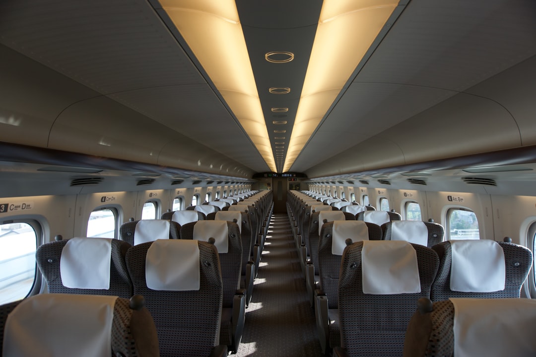 the inside of an airplane with rows of seats,
