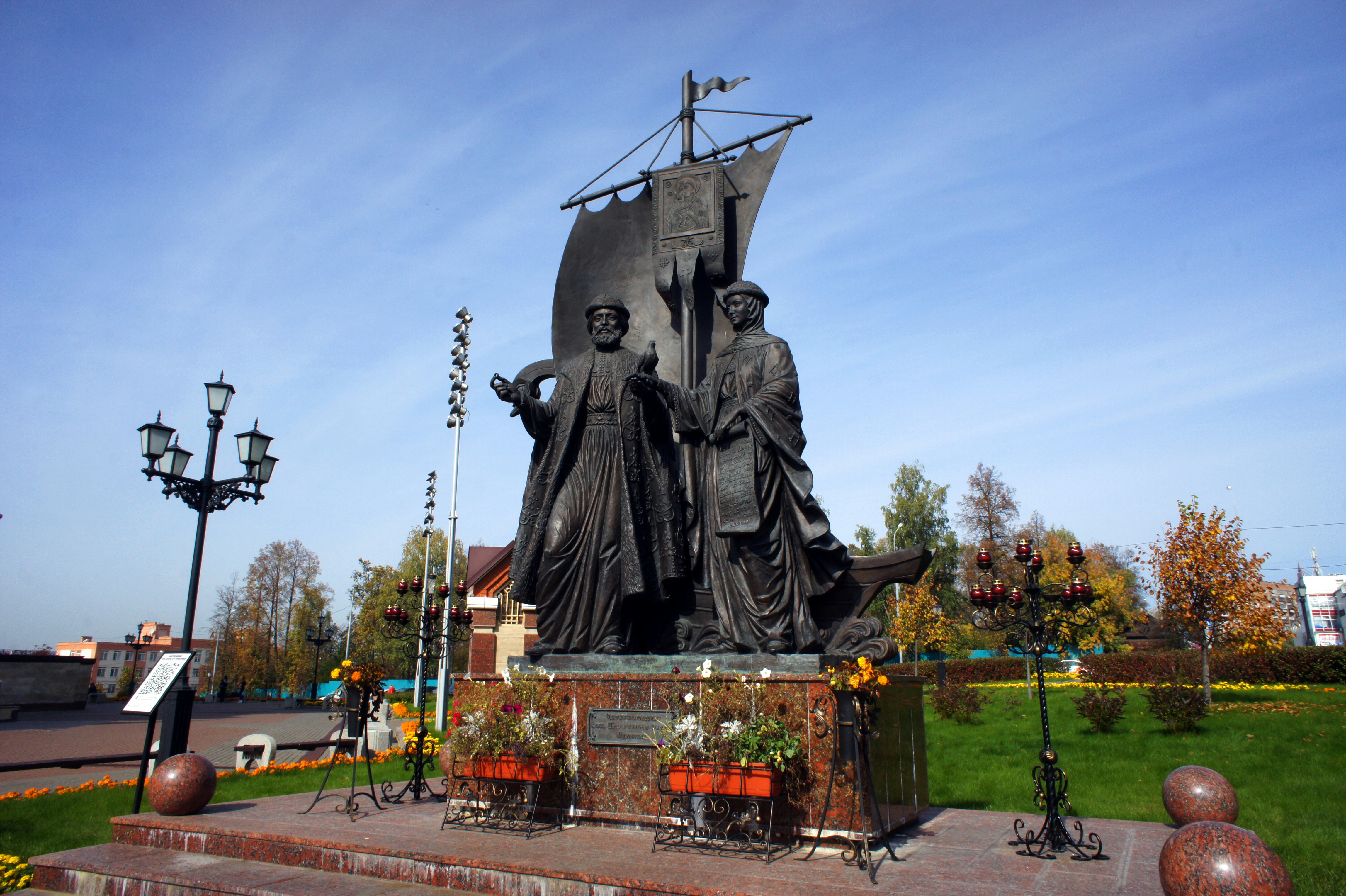 a statue of two women standing next to each other