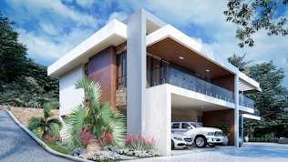 a white car is parked in front of a house