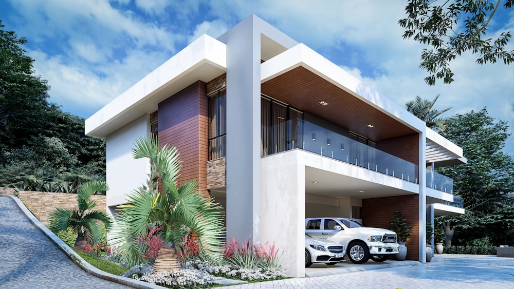 a white car is parked in front of a house