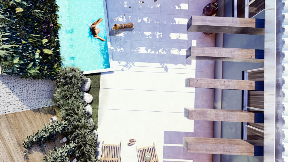 an aerial view of a swimming pool and deck