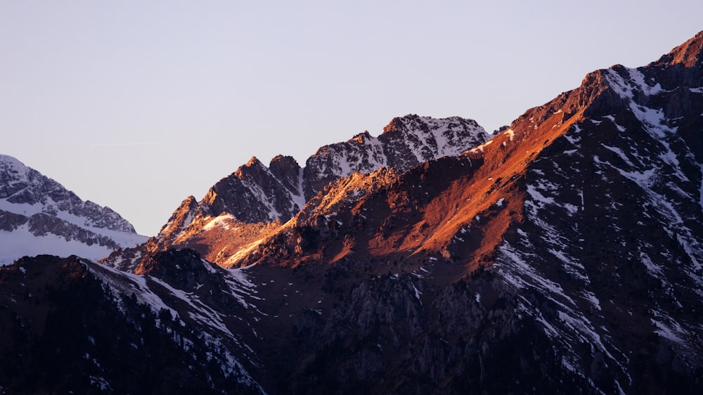 a group of mountains with snow on them