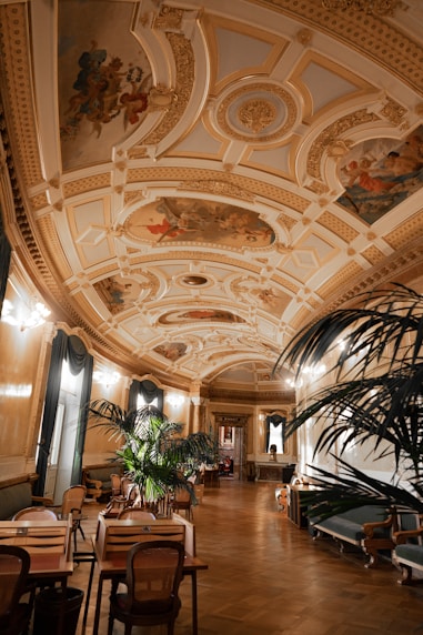 a large room with a ceiling painted with murals