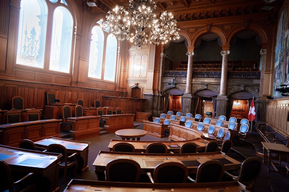 a large room with chairs and a chandelier