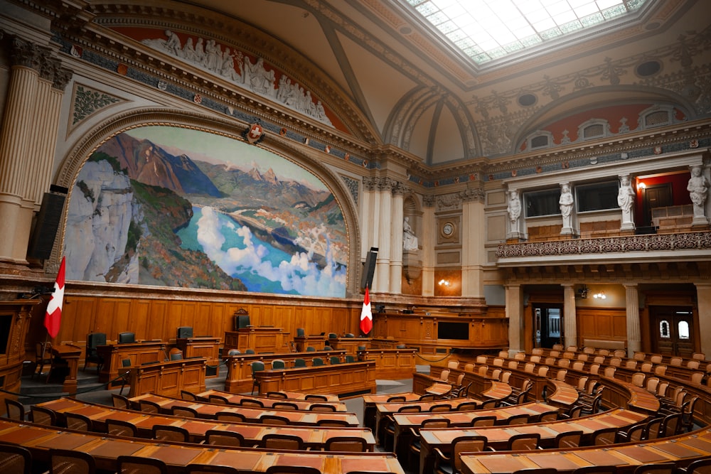 a large room with a painting on the wall