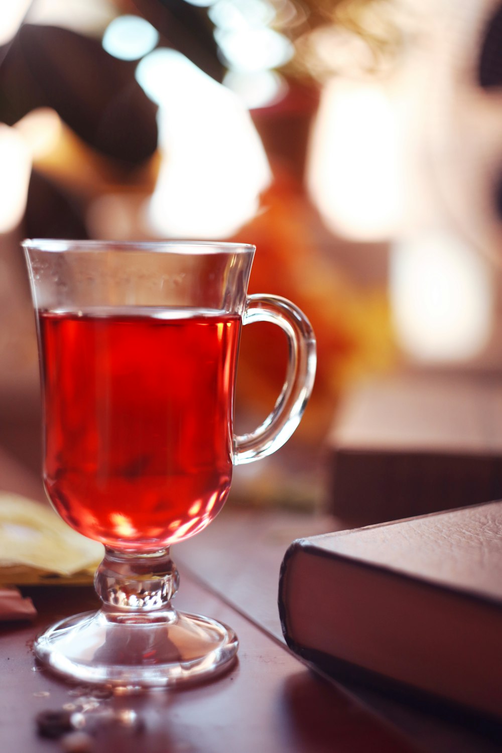 a cup of tea sitting on top of a wooden table