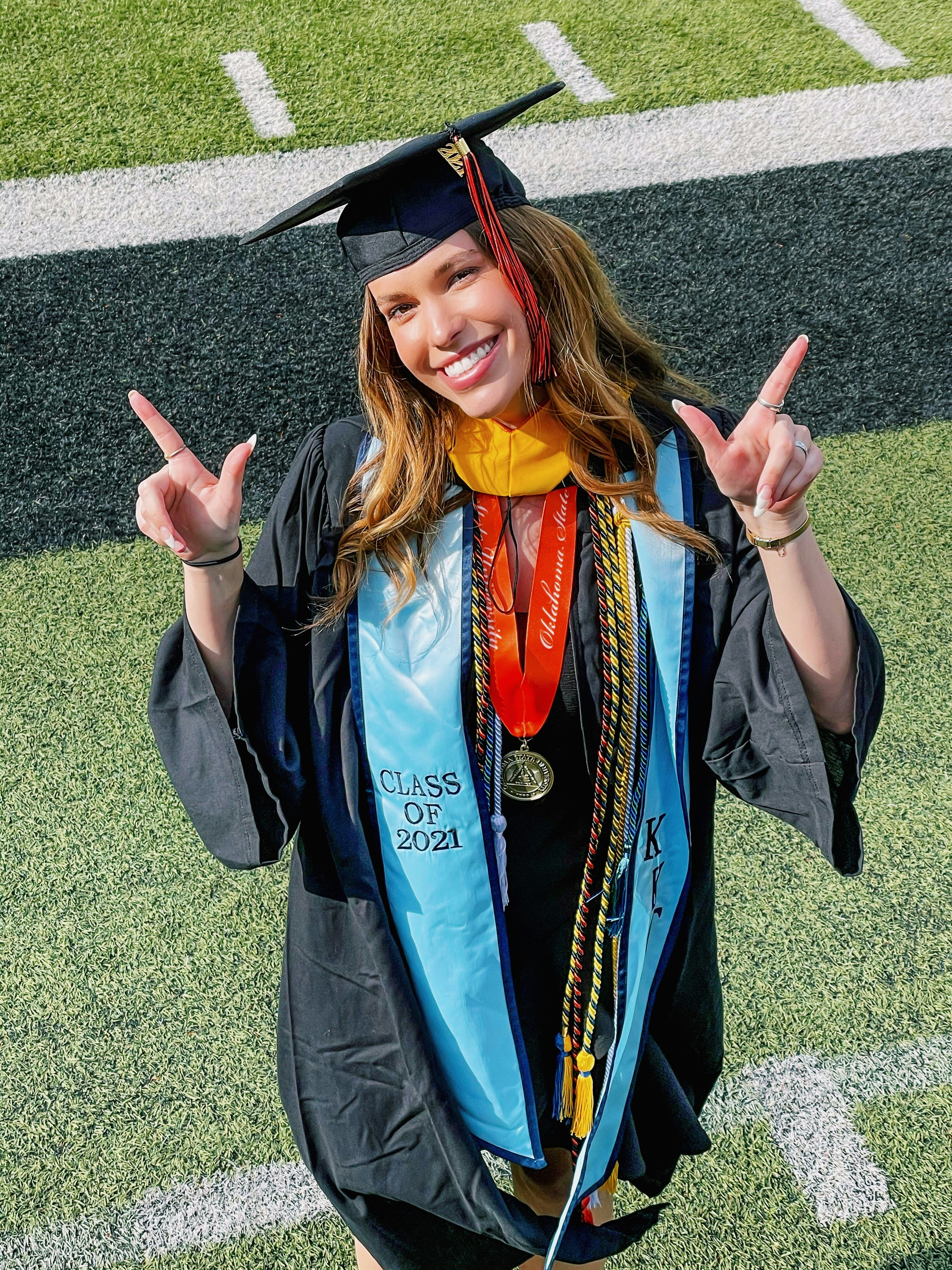 a woman in a graduation cap and gown