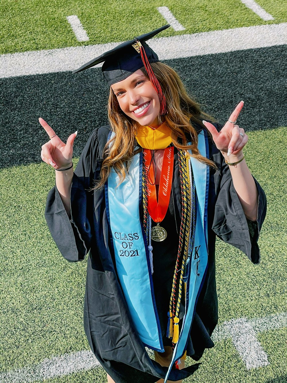 a woman in a graduation cap and gown