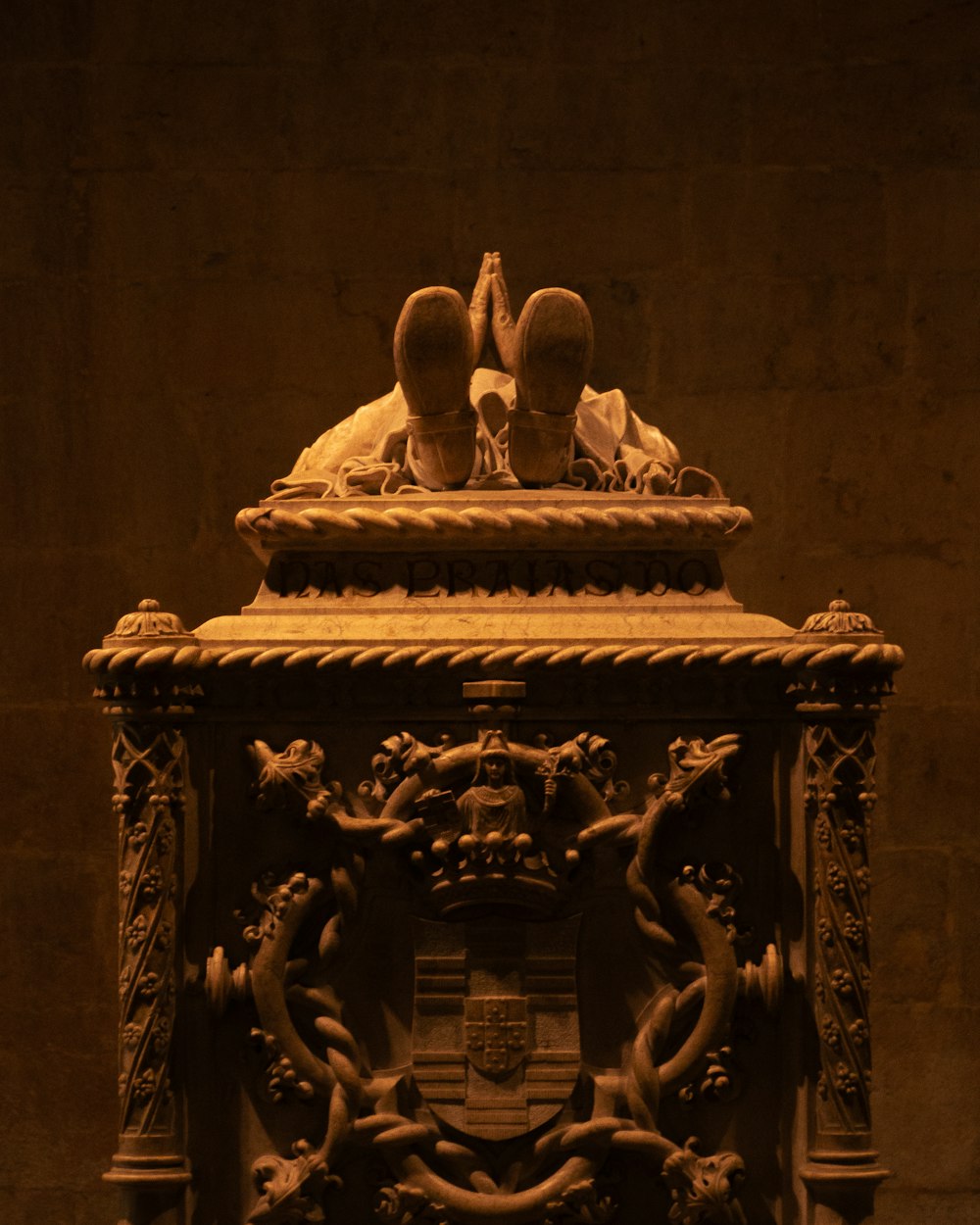 a statue of two people sitting on top of a table