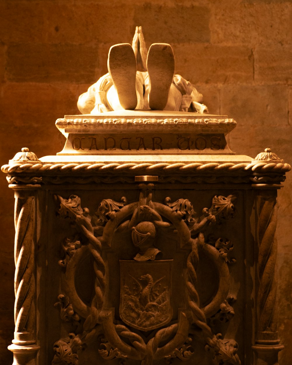 a close up of a statue on a pedestal