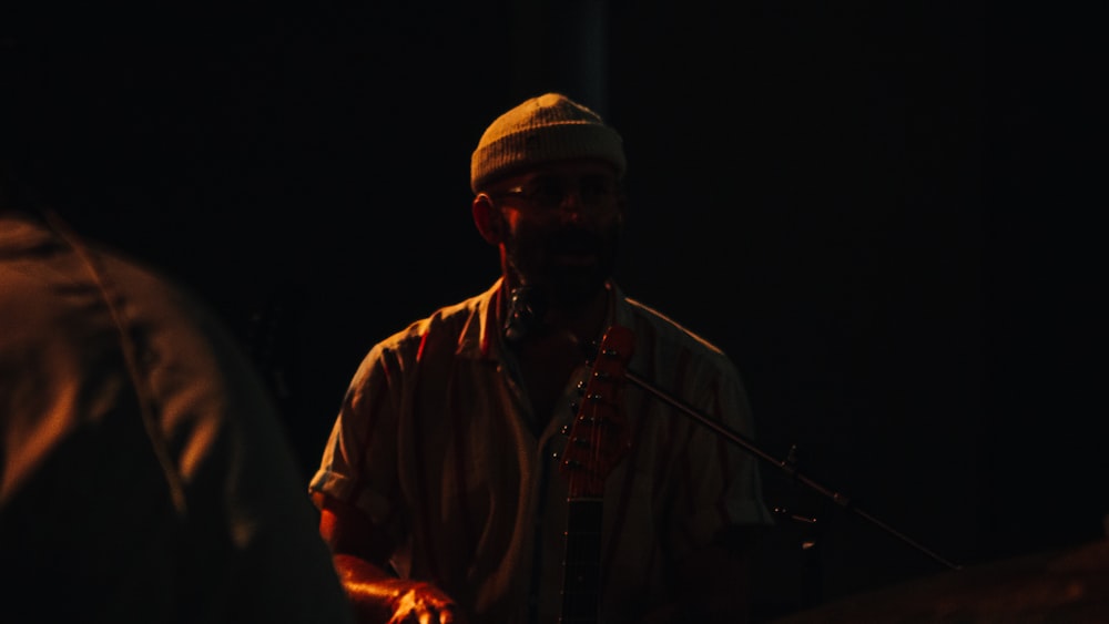 a man standing in front of a microphone