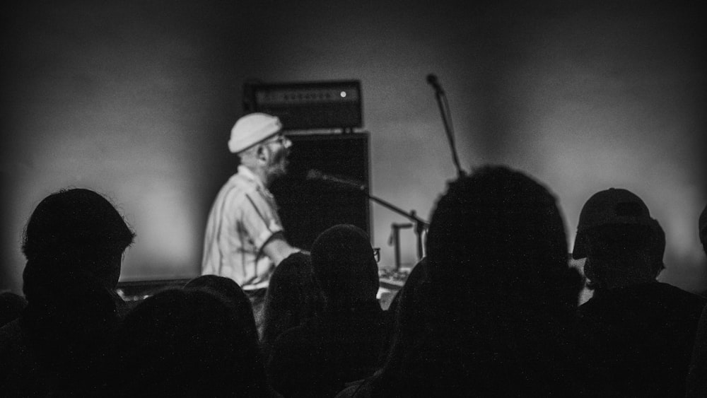 a man standing in front of a crowd of people