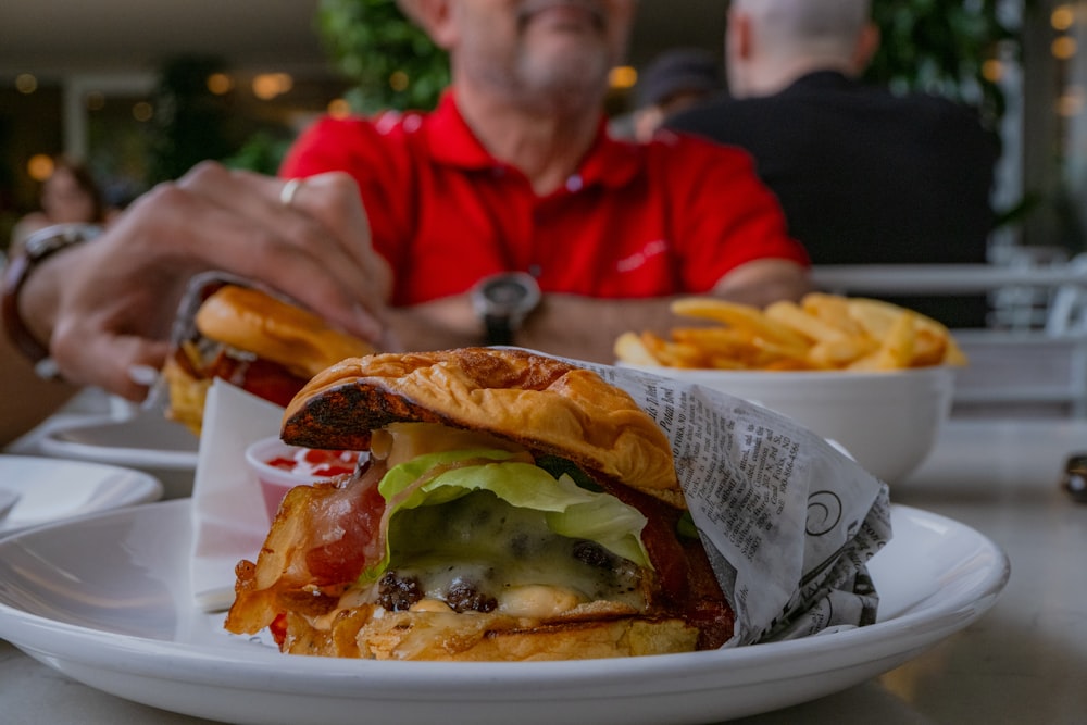 a close up of a plate of food with a sandwich