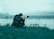 a photographer taking a picture of a body of water