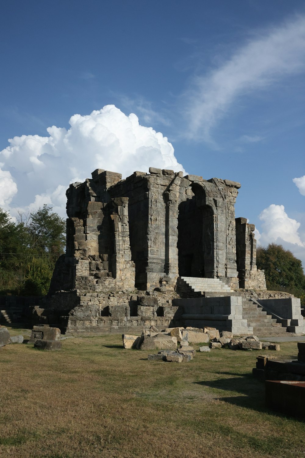 a large stone structure sitting in the middle of a field