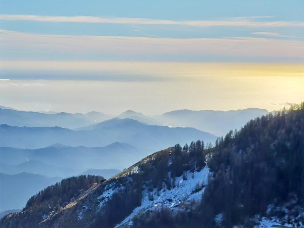 a view of a mountain range covered in snow