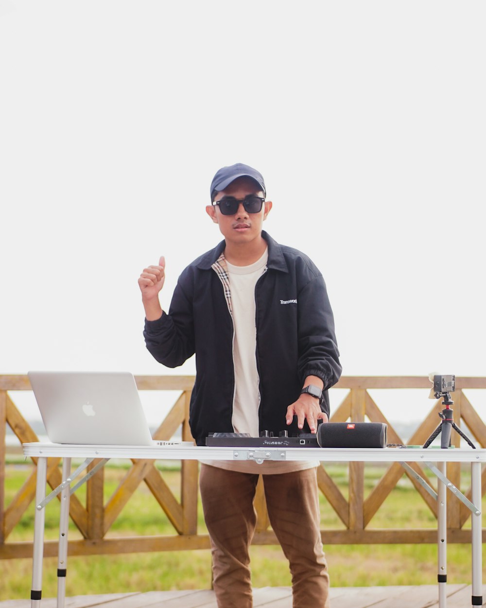 a man standing in front of a laptop computer