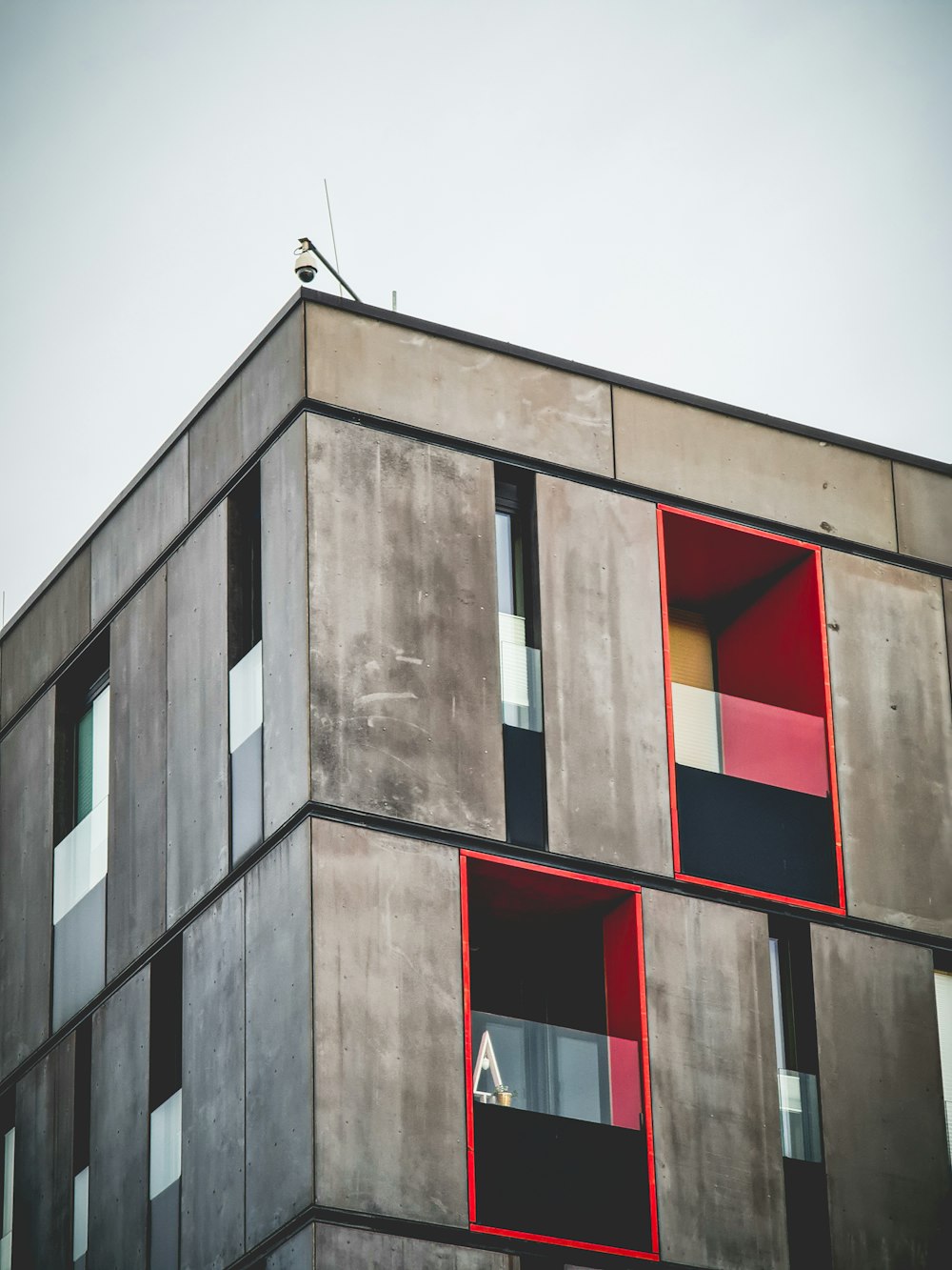 a bird is perched on top of a building