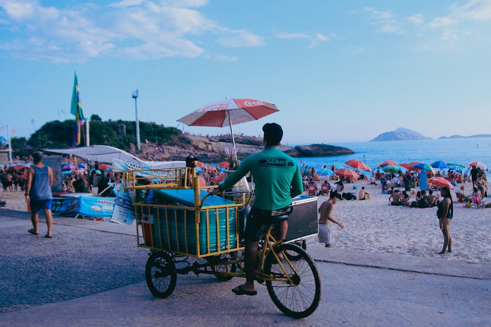 a man riding a bike with a basket on the back of it