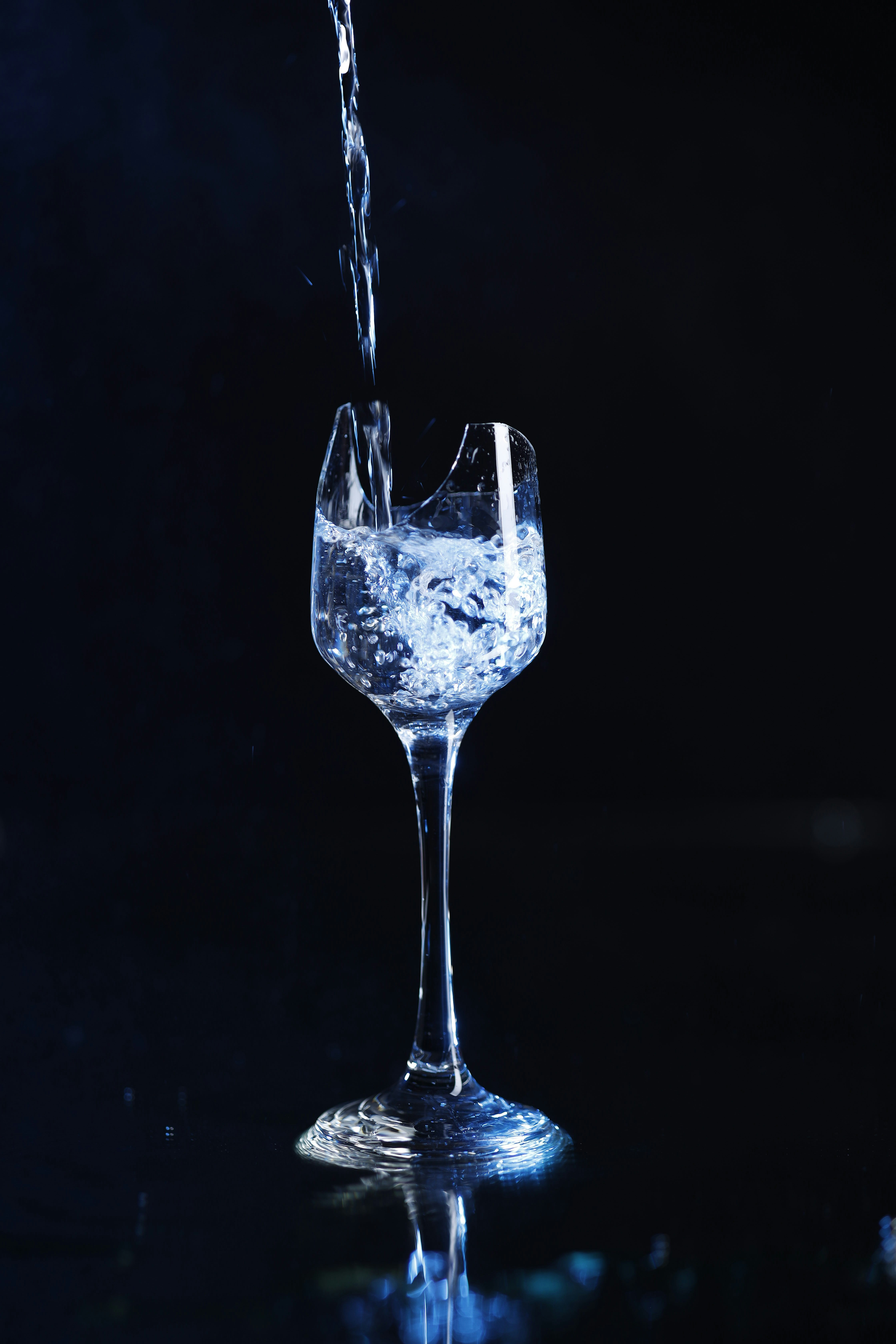 a glass of water being poured into it