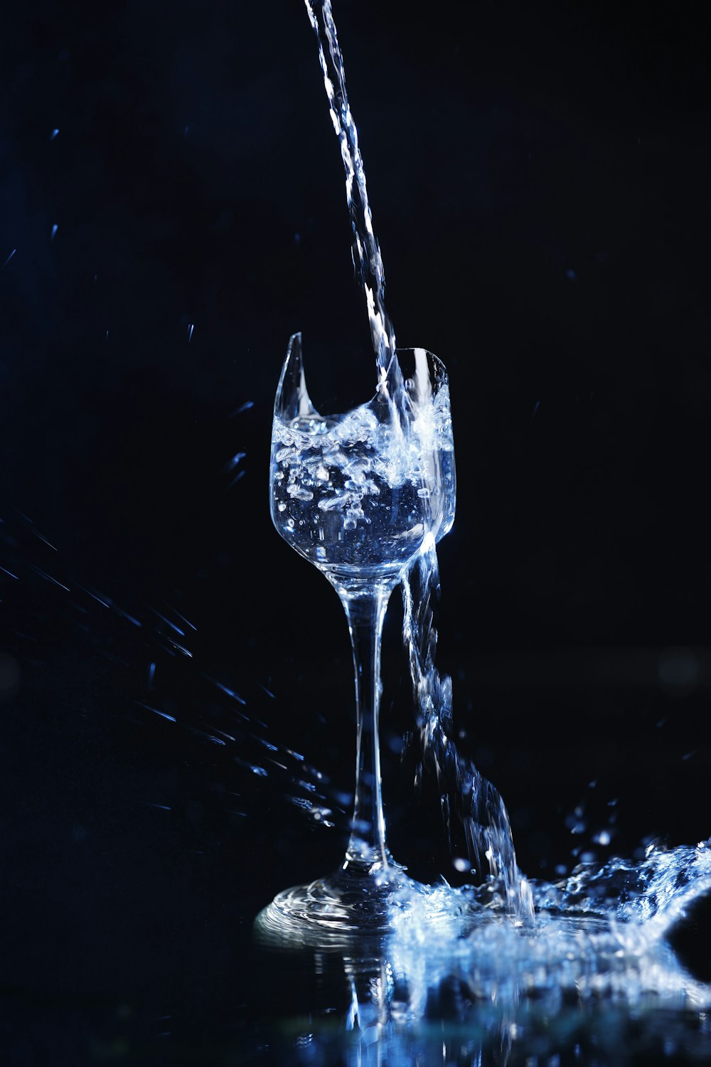 a glass of water being poured into it