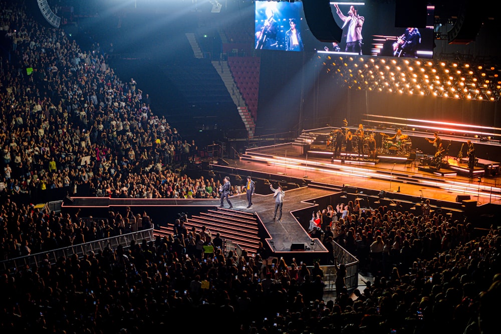 a group of people standing on top of a stage