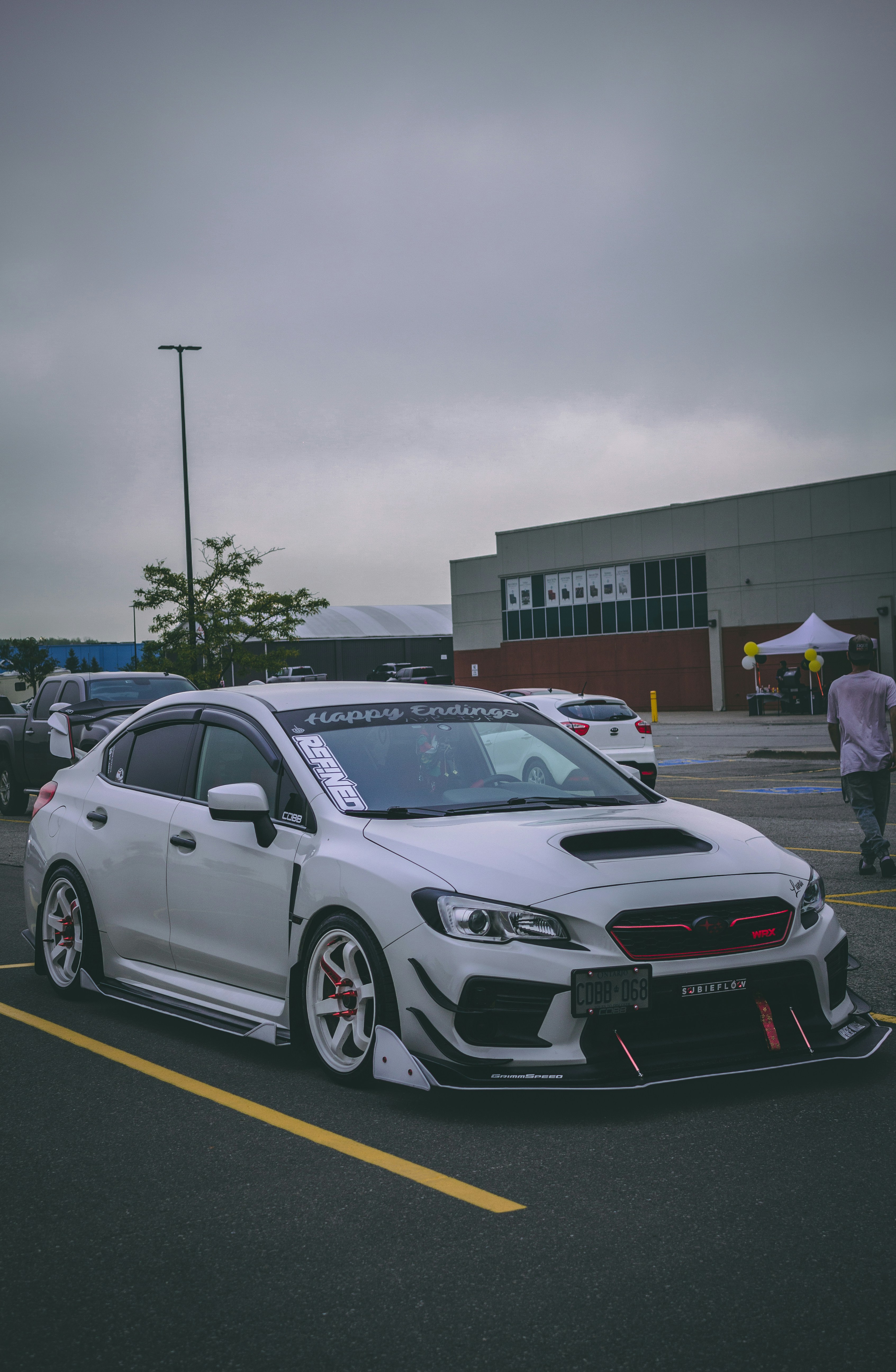 a white car parked in a parking lot