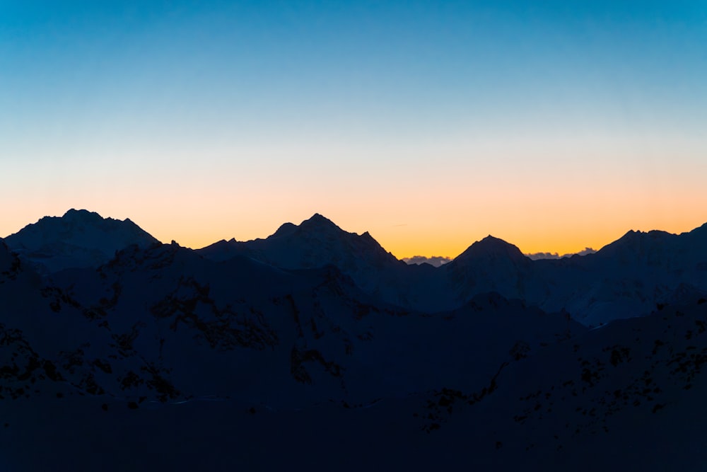 a view of a mountain range at sunset