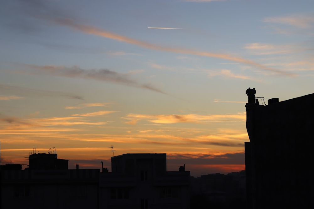 a view of a city skyline at sunset