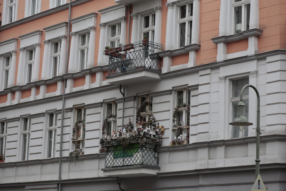 a tall building with lots of windows and balconies