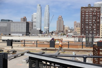 a construction worker standing on top of a roof