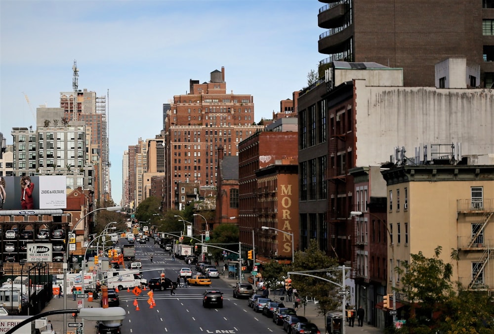 a city street filled with lots of tall buildings