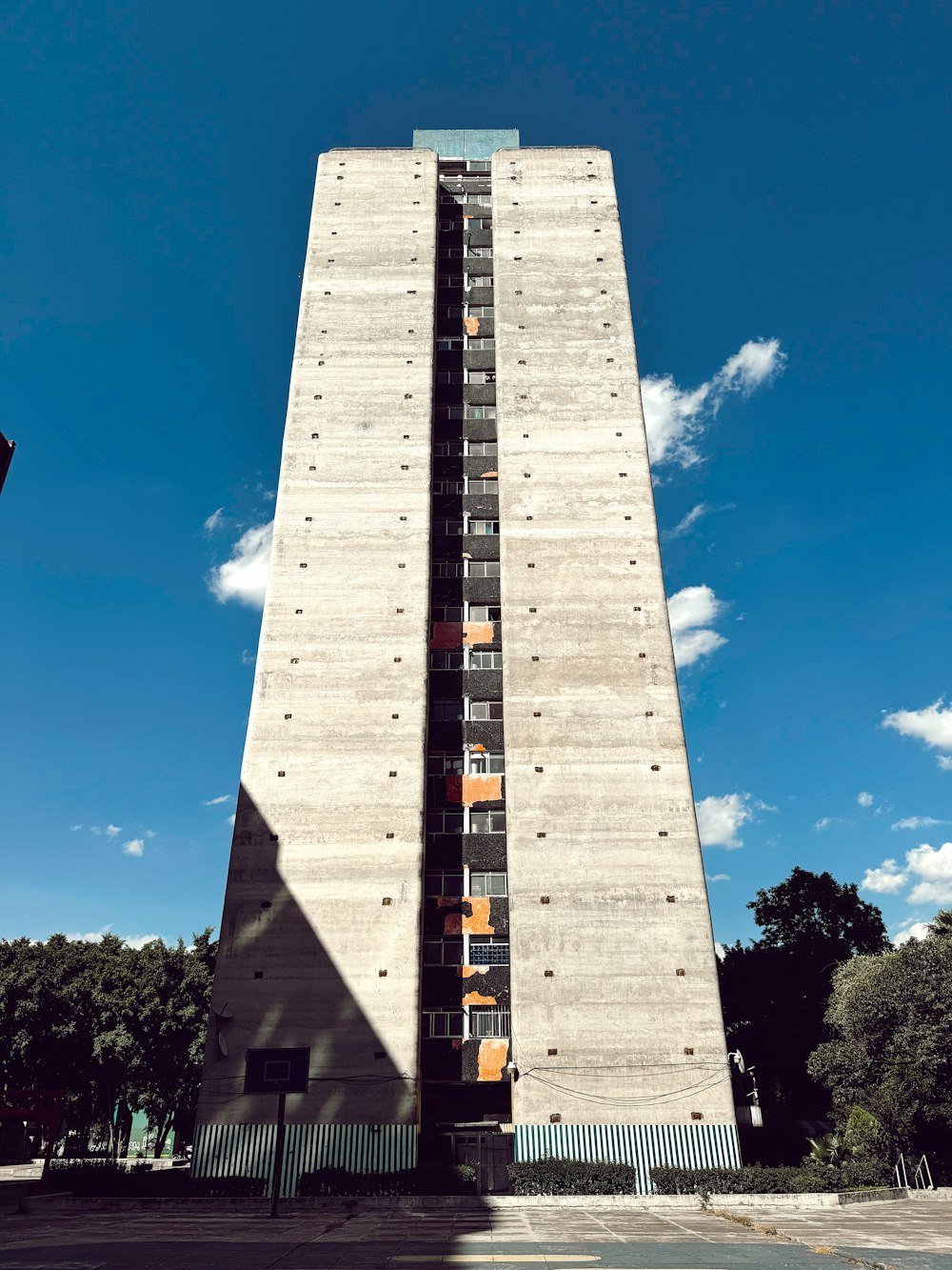 a tall building with a lot of windows on the side of it