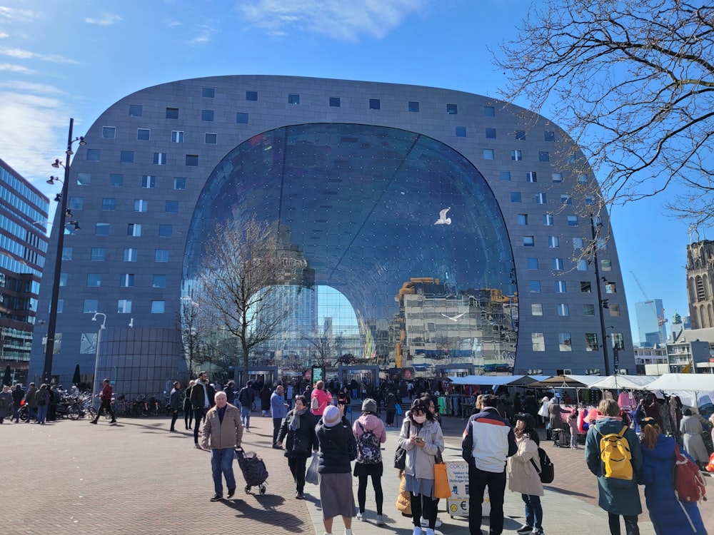 a group of people standing in front of a building