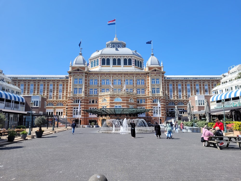 a large building with a fountain in front of it