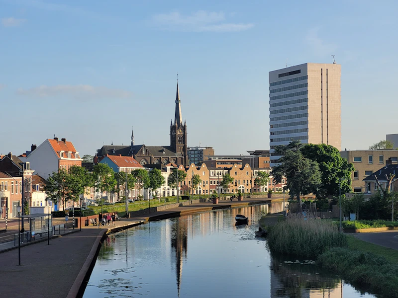 Canal and clock tower in Delft, Netherlands