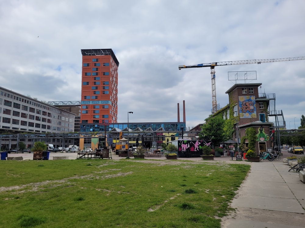 a large building with a crane in the background