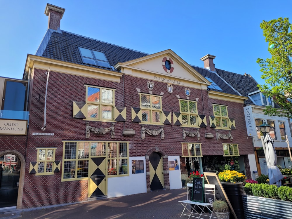 a red brick building with many windows and decorations