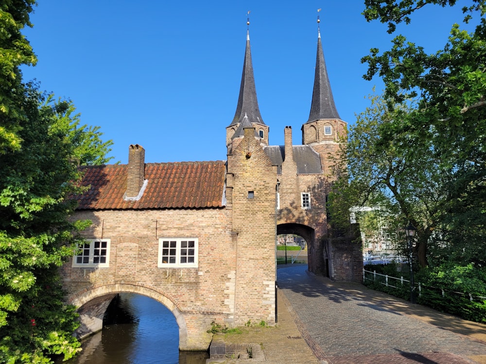 a castle with two towers and a bridge