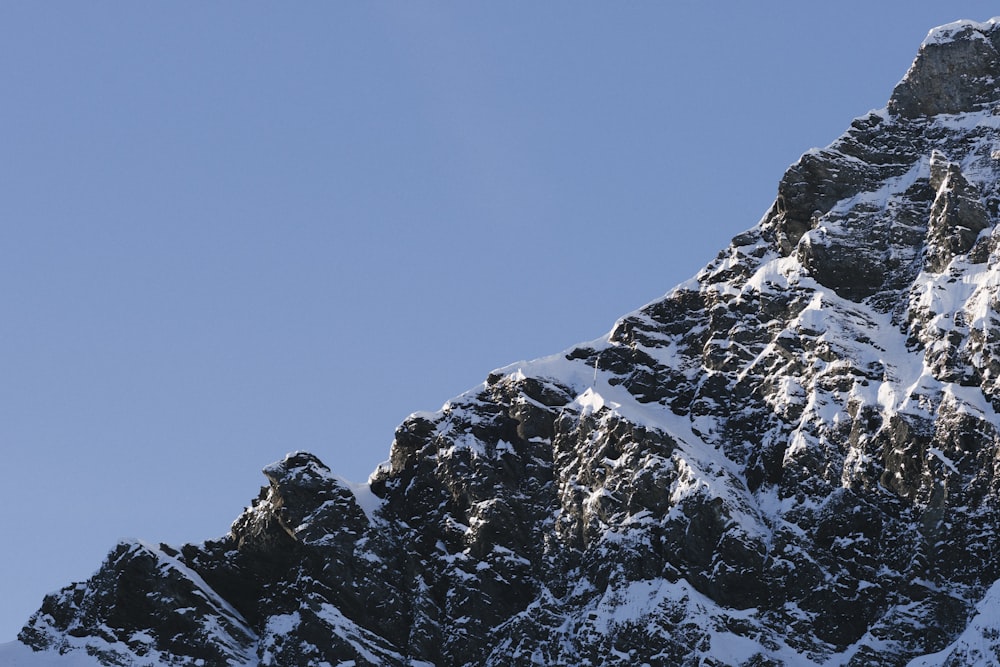 a very tall mountain with snow on it