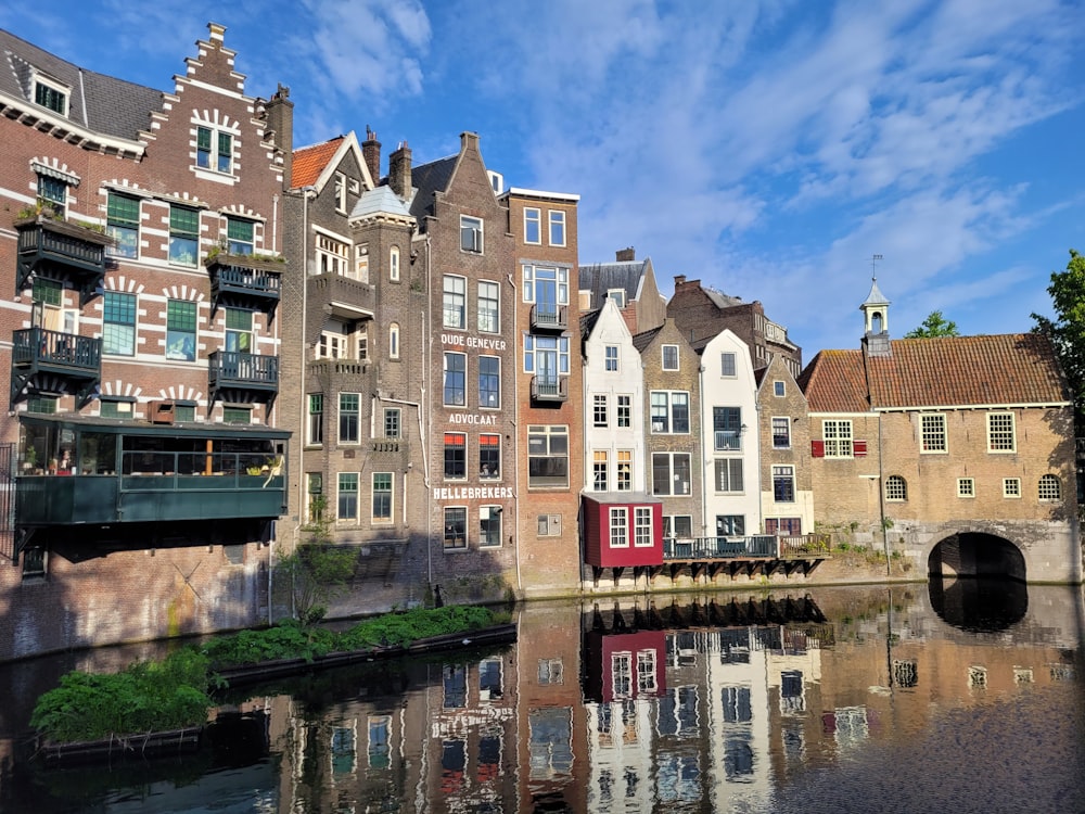 a row of buildings next to a body of water