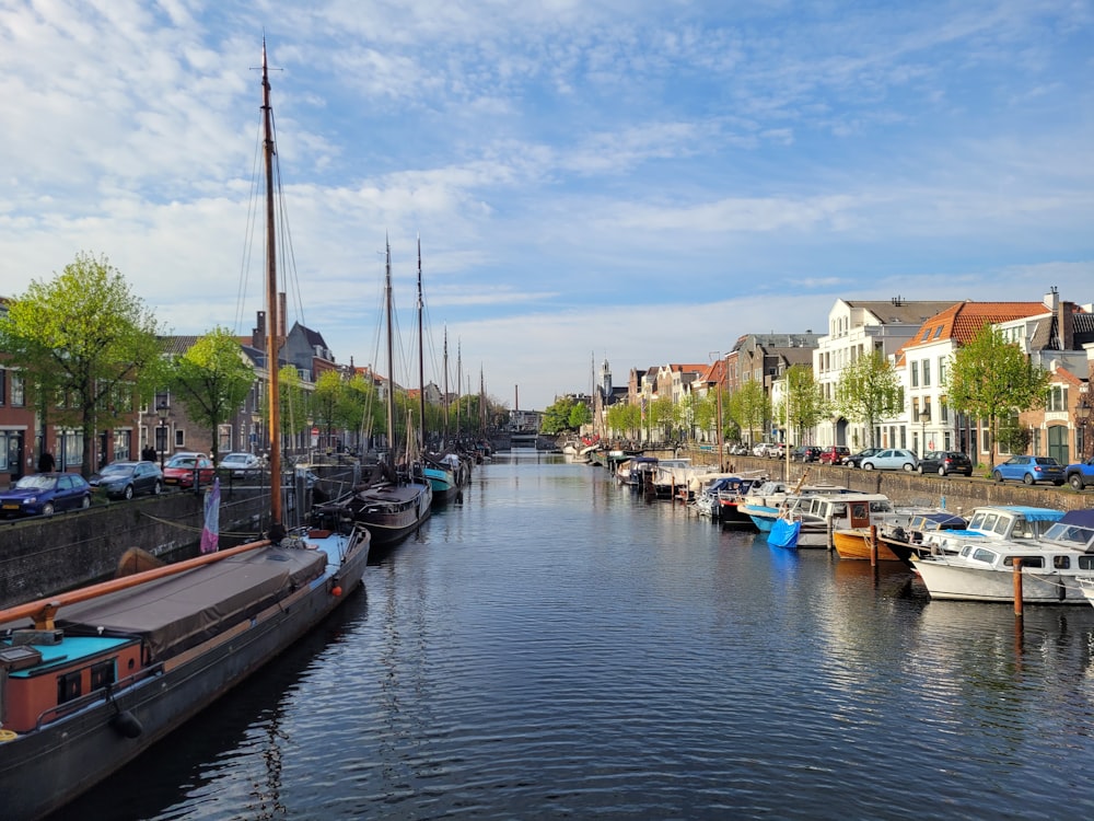 a waterway with boats parked on both sides of it