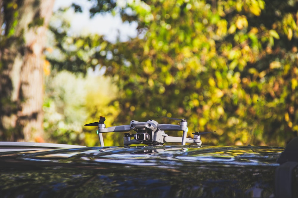 a close up of a vehicle with trees in the background