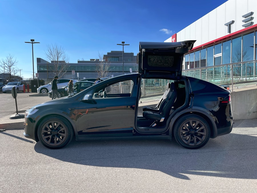 Black Tesla Model X with falcon wing doors open