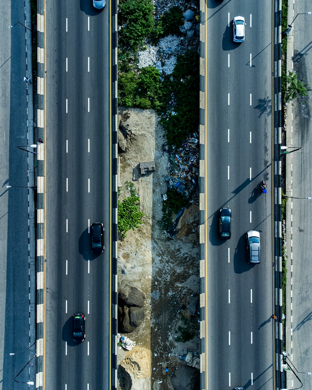 an aerial view of a street with cars on it