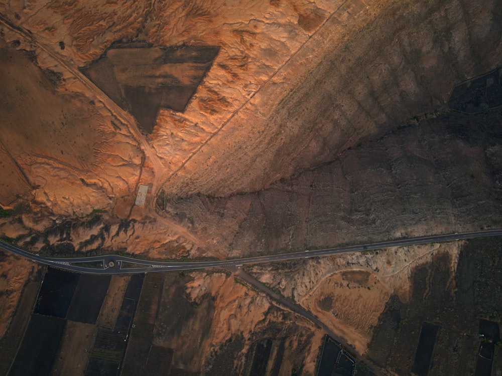 an aerial view of a road in the desert