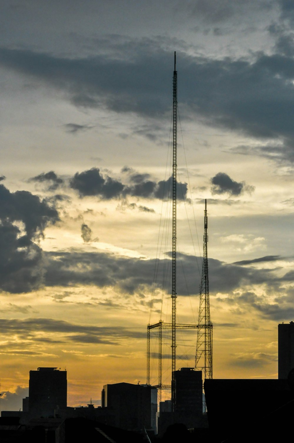 a very tall tower sitting in the middle of a city