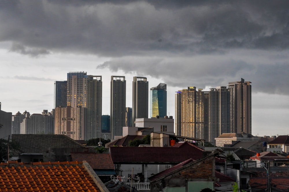 a view of a city with tall buildings under a cloudy sky